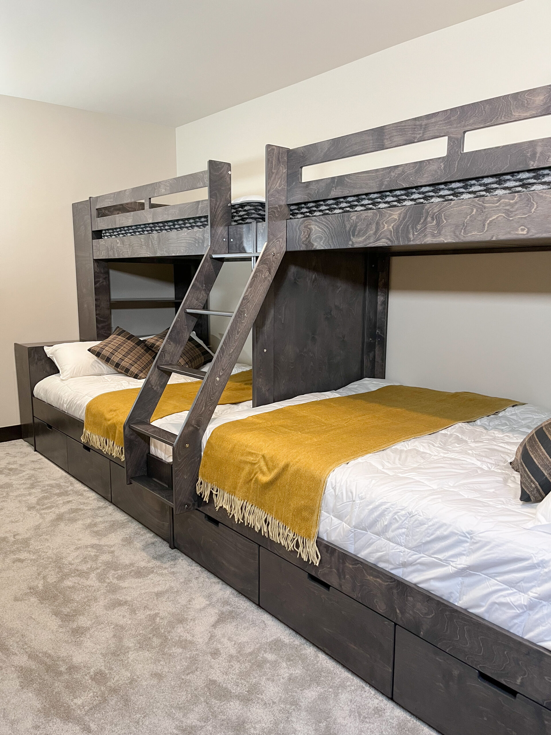 a grey stained beautiful bunk room set. the stain shows the grain so beautiful. with us you can order a bed like this online.